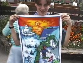 Nick buys a very attractive Norwegian towel for himself from the souvenir shop in Lom
